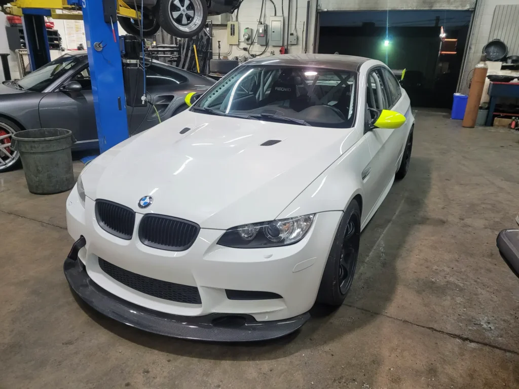 White BMW M3 in the Alpine Autowerks shop