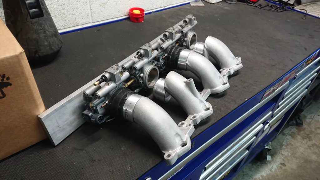 Individual throttle body intake assembly on the workbench
