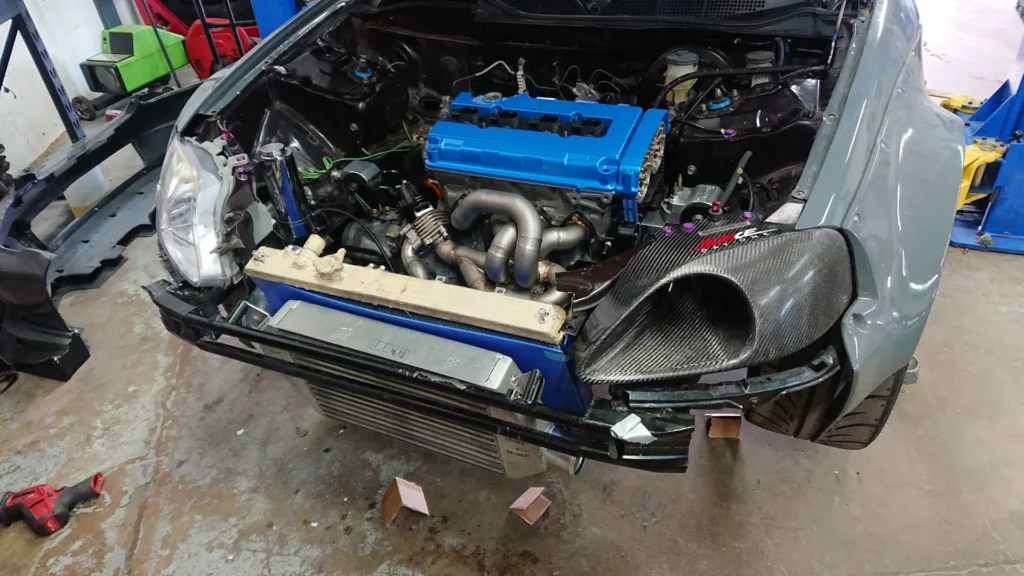 Turbocharged engine with a front-mounted intercooler and the bumper removed